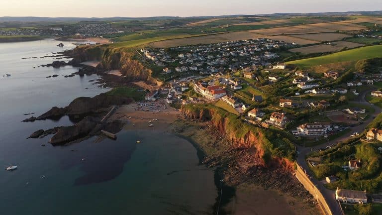 Hope Cove village and beaches in South Devon at sunset